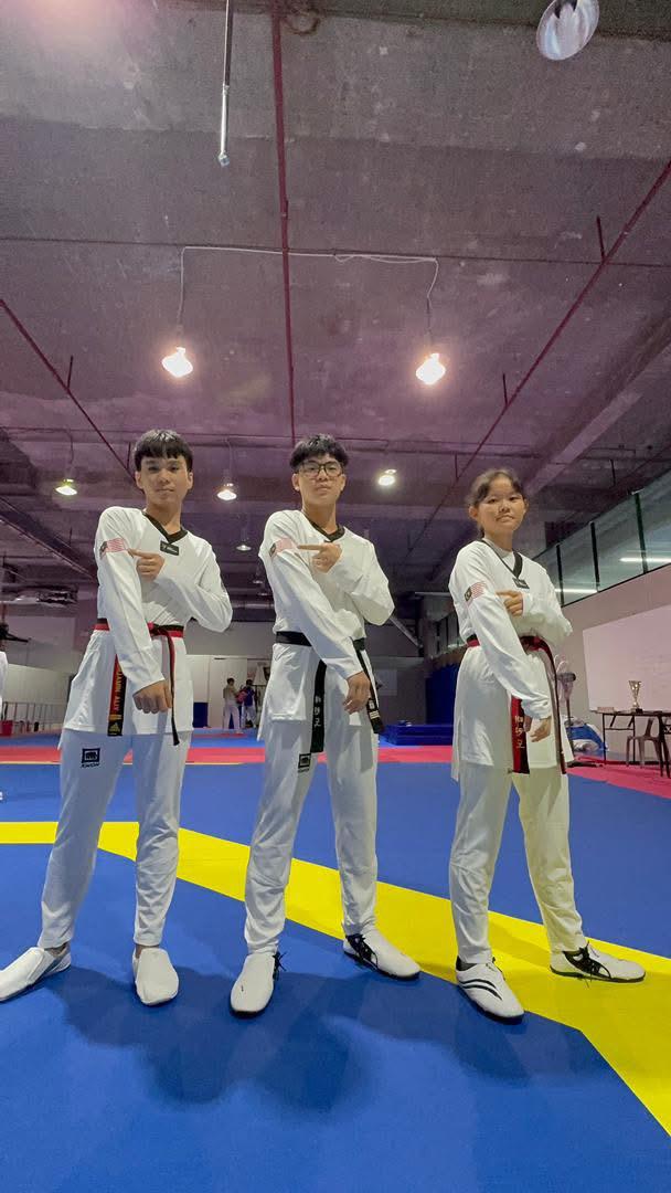 Newgen athletes in black-belt uniforms